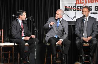 Gov. Jim Gibbons, center, answers questions with candidates Brian Sandoval, left, and Mike Montandon during the Republican gubernatorial debate in Reno on Friday, April 23, 2010. 