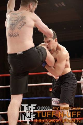 John Gettle catches a kick from Erick Kapp during the Tuff-N-UFF Amateur Fighting Championships at The Orleans on April 23, 2010. Gettle won the fight via first round submission.