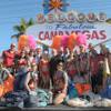 Skydivers and showgirls flank Clark County Commissioner Tom Collins, Holly Madison, Las Vegas Mayor Oscar Goodman and Wayne Newton at the unveiling of the Welcome to Fabulous Camp Vegas sign on April 29, 2010.