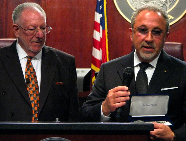 Grammy-award winning musician Emilio Estefan, right, accepts a ceremonial key to the City of Las Vegas, which he will share with his wife, Gloria Estefan, this morning at Mayor Oscar Goodman's weekly press conference. Estefan is in Las Vegas to take part in the annual Senores of Excellence - Senoras of Distinction Gala on Saturday at Wynn Las Vegas. The gala benefits the Latin Chamber of Commerce Scholarship Fund. Estefan is also working  with other Nevadans to establish the National Museum of the American Latino in Washington, D.C.