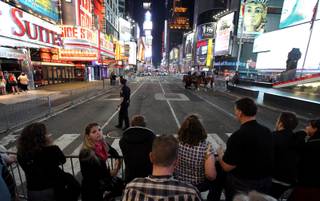 Times Square is void of pedestrians just south of 46th Street in New York on Saturday. Police have closed some streets in New York City's Times Square as they investigate a car that has been 