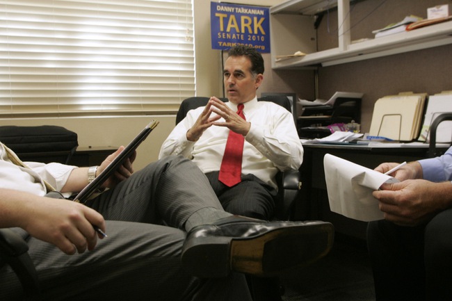 Policy director Ben Stecker (L) and volunteer Dean Stump help Danny Tarkanian prep for a Republican debate Friday, April 30, 2010.