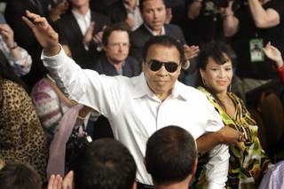 Boxing legend Muhammad Ali, center, is introduced before the welterweight fight between Floyd Mayweather Jr. and Shane Mosley Saturday at the MGM Grand Garden Arena on May 2, 2010.
