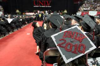 Graduates at the Thomas & Mack Center wait for the 2010 UNLV commencement ceremony to begin Saturday.