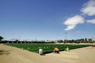 Workers from CG&B and UBU Sports Surfaces install new synthetic turf at Rebel Park on the UNLV campus Tuesday, May 11, 2010.