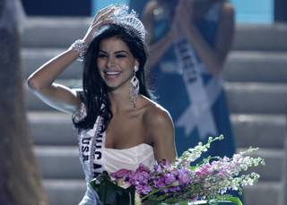 Miss Michigan Rima Fakih reacts after being crowned Miss USA during the 2010 Miss USA pageant at the Planet Hollywood Resort and Casino in Las Vegas on May 16, 2010. 