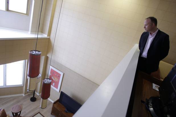 Arik Knowles, vice president of hotel operations, looks down into the living area of a renovated penthouse suite at the Tropicana on Monday. Eight of the nine 2,000-square-foot suites have their own Jacuzzi. The property is going through its first major renovation in nearly 25 years.