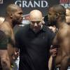 UFC President Dana White separates light heavyweight fighters Quinton "Rampage" Jackson and "Suga" Rashad Evans as they face off during an official weigh-in Friday at the Mandalay Bay Events Center. UFC 114 takes place Saturday at the MGM Grand Grand Garden Arena.