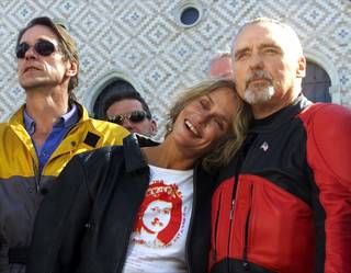 British actor Jeremy Irons, left, actress Lauren Hutten, and actor Dennis Hopper stand outside the Guggenheim Las Vegas museum during pre-opening festivities for the exhibition hall at The Venetian hotel-casino Thursday October 4, 2001. The celebrities are members of the Guggehheim Motorcycle Club and the inaugural exhibit at the new museum is 