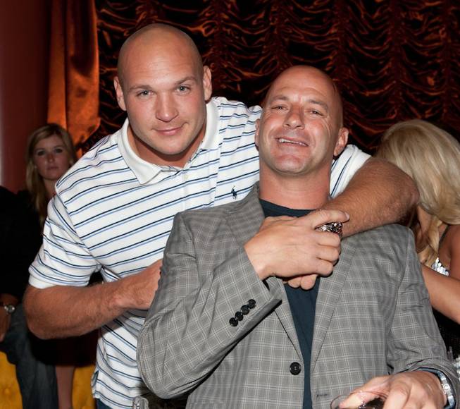 Brian Urlacher of the Chicago Bears and Surrender partner Bob ...