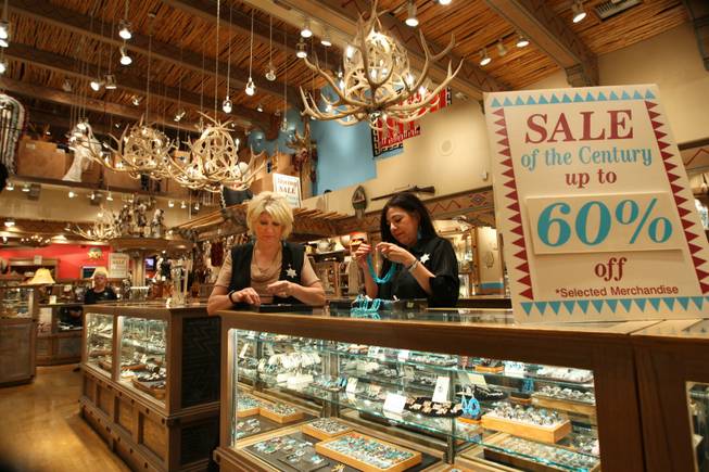  Sales clerk Phyllis Beauchmin and manager Sylvia Miller, right, organize turquoise jewelry in preparation for the final day of business, May 31st, at West of Santa Fe in the Forum Shops at Caesars.