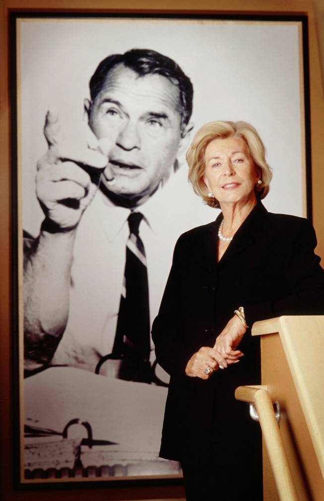Las Vegas Sun Publisher Barbara Greenspun poses in front of a portrait of her late husband and Sun founder Hank Greenspun in the offices of Greenspun Media Group. June 2000. 