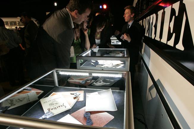 Invited guests look at memorabilia at a media event for the Las Vegas Mob Experience Monday, June 8, 2010 at the Tropicana.