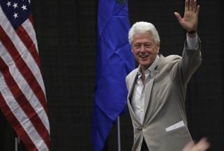 Former President Bill Clinton arrives at a campaign rally for Senate Majority Leader Harry Reid on Thursday at the Andre Agassi College Preparatory Academy.