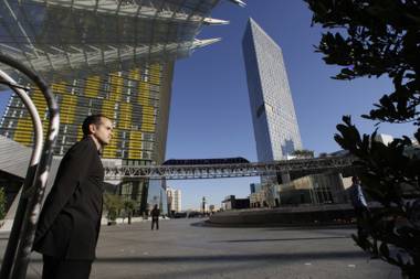A bellman stands in front of Aria. Long waits to check in are among the complaints voiced by online reviewers about the&nbsp;hotel.