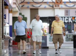 From left, Tom Harrop, 81, and Keith Bengtson, 82 and Norman Seiler, 71, walk on the upper level at the at Galleria Mall at Sunset in Henderson Wednesday, June 30, 2010. Sunstriders, a group of mostly senior citizens, spend their mornings walking at the mall. The group is 30 to 40 members strong.