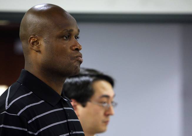 Former NBA player Antoine Walker makes an initial appearance in District Court at the Regional Justice Center in Las Vegas, Wednesday, June 30, 2010. Walker's attorney Jonathan Powell is at right. Walker is facing felony bad check charges for allegedly failing to meet obligations to repay some $900,000 in gambling debts and penalties to three Las Vegas casinos.