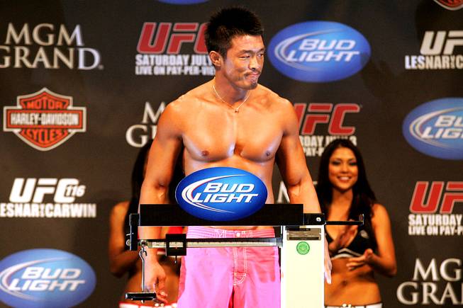 Yoshihiro Akiyama stands on the scale during the weigh in for UFC 116 Friday, July 2, 2010. Akiyama will fight Chris Leben in a middleweight bout on Saturday.