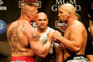 Brock Lesnar (L) and Shane Carwin face off during the weigh in for UFC 116 Friday, July 2, 2010. The two face each other Saturday for the UFC heavyweight title.