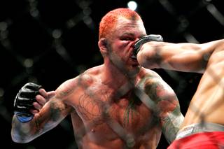 Chris Leben gets tagged by Yoshiro Akiyama during their middleweight bout Saturday at UFC 116 . Fighting on short notice only two weeks after his last fight, Leben submitted Akiyama in the third round.