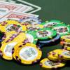 Poker chips and cards are shown on a table during the first day of the 41st annual World Series of Poker no-limit Texas Hold 'em main event Monday, July 5, 2010. It's expected that 6,000 to 7,000 players will pay the $10,000 buy-in to enter the tournament, officials said. 