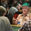 Daniel Harrington talks with another player at his table during the 41st annual World Series of Poker Main Event on Tuesday at the Rio.