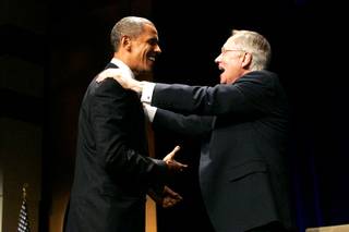 President Barack Obama is thanked by Senate Majority Leader Harry Reid after a campaign speech July 8, 2010, at Aria.