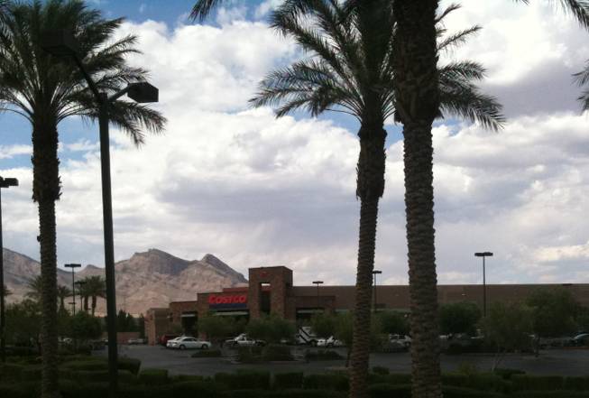 Metro Police officers investigate an officer-involved shooting Saturday afternoon at the Costco store in Summerlin.