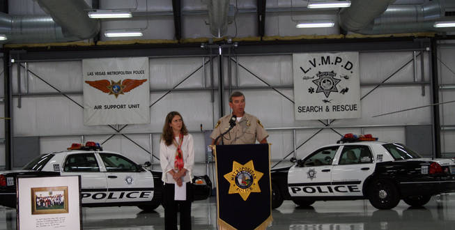 Sheriff Doug Gillespie speaks to the media about a new campaign to get officers to drive safely while Vanessa Maniago, left, vice president of strategic development for R &amp; R Partners, which helped with the campaign, listens.