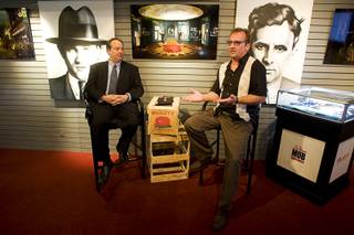 Jay Bloom, left, managing partner of Murder Inc., listens to Meyer Lansky II, grandson of organized crime figure Meyer Lansky, during a news conference at The Mob Experience preview center at the Tropicana on Aug. 2, 2010.