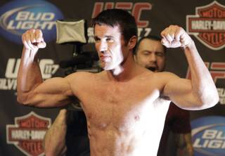 Chael Sonnen flexes after weighing in for UFC 117 in Oakland, Calif. 