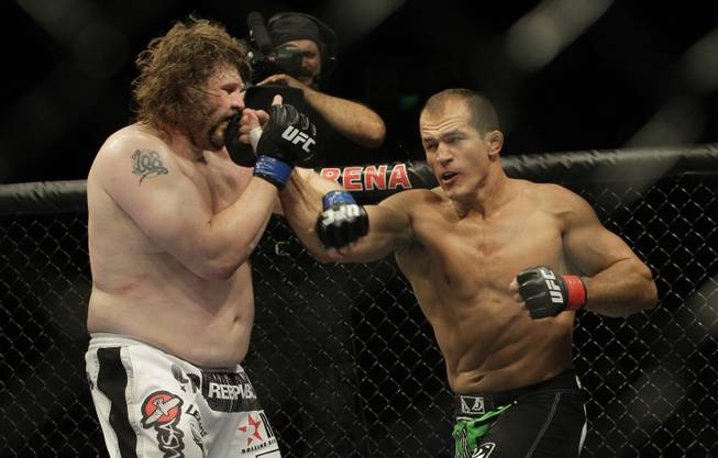 Junior Dos Santos, right, punches Roy Nelson during UFC 117 on Aug. 7, 2010 in Oakland, Calif. Dos Santos won by unanimous decision.