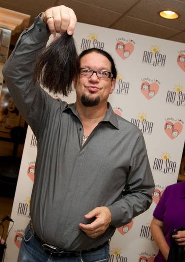 Penn Jillette with his severed ponytail at the Rio Spa & Salon on Aug. 25,&nbsp;2010. 