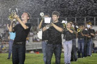 The Basic marching band got a surprise in the form of sprinklers during its halftime performance at Friday's game against Boulder City.