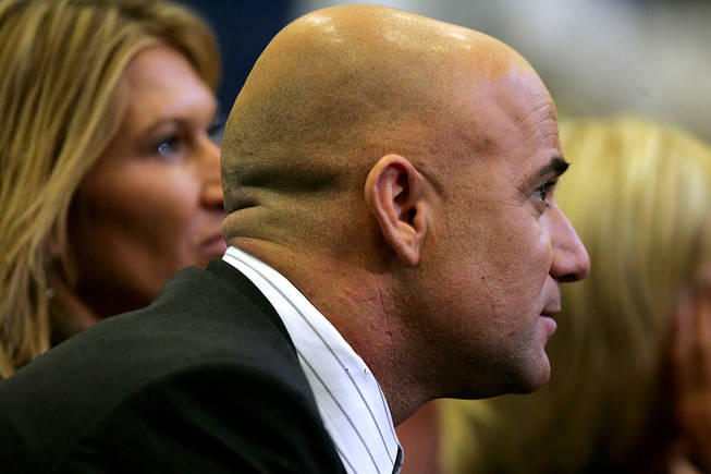 Steffi Graf and Andre Agassi listen to Rory Reid and Brian Sandoval during a debate on education between the gubernatorial candidates Sunday, August 29, 2010.