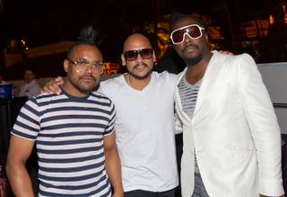 The Black Eyed Peas' apl.de.ap and will.i.am flank manager Polo Molino at Moorea Beach Club at Mandalay Bay on Sept. 4, 2010.

