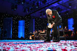 As the celebration confetti lies on the floor, Jerry Lewis breaks down in joyous tears after hearing the final tally of $58,919,838 Monday afternoon in the final hour of the 45th Annual Jerry Lewis MDA Labor Day Telethon.