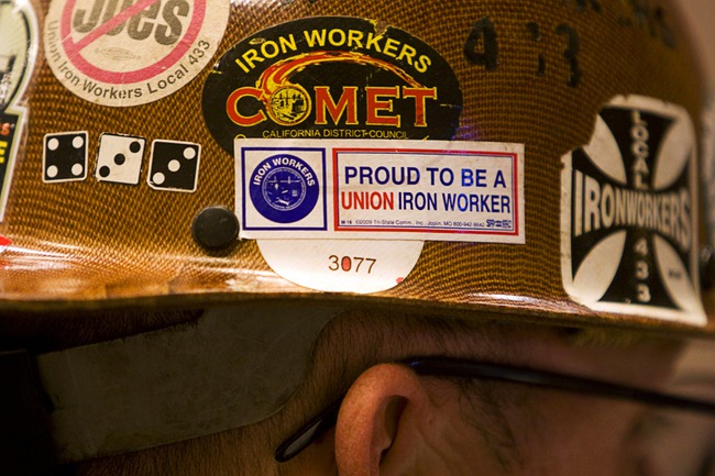 An iron worker wears his helmet during a rally at the Painters and Allied Trades, District Council 15 and Local Union 159, union hall in Henderson Thursday, Sept. 9, 2010. The rally of union members and unemployed workers was held to attack Republican Senate candidate Sharron Angle for her position against 