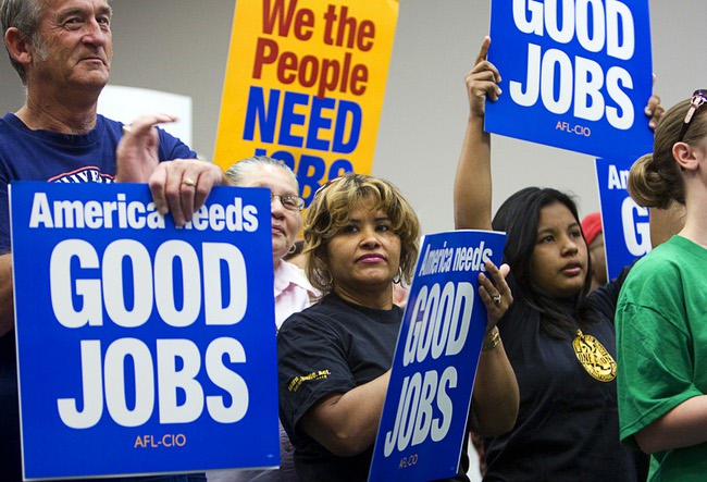 Juana Valladares, center, a house person at Harrah's, attends a rally at the Painters and Allied Trades, District Council 15 and Local Union 159, union hall in Henderson Thursday, Sept. 9, 2010. The rally of union members and unemployed workers was held to attack Republican Senate candidate Sharron Angle for her position against 