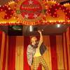 Dickie Sunrise entertains patrons of the Palms in a room shared by a circus stage and machines used by participants in slot tournaments.