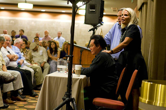 Kathleen Newton gives a back rub to her husband during a meeting at the La Quinta Inn Monday, September 20, 2010. Entertainer Wayne Newton hosted the neighborhood meeting to discuss development plans that would include tours on his property.