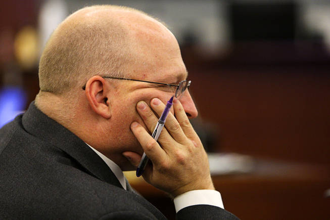 Chief Deputy District Attorney Christopher Laurent listens as a recorded interview with Erik Scott's girlfriend, Samantha Sterner, is played during a coroner's inquest for Erik Scott at the Regional Justice Center Friday, September 24, 2010.