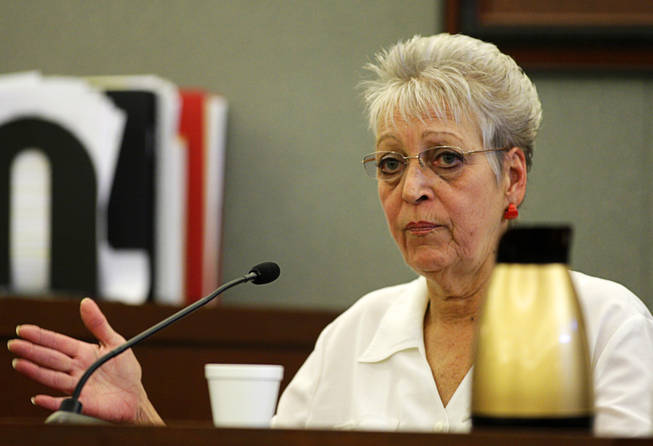 Linda Bem, the Costco employee who helped Scott sign up for a Costco membership, testifies during a coroner's inquest for Erik Scott at the Regional Justice Center Friday, September 24, 2010. Bem said Scott had a hard time understanding her instructions and filling out the forms. 