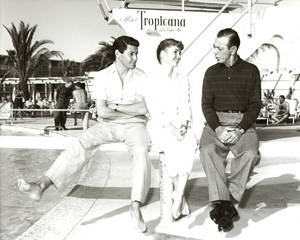 In this photo provided by Las Vegas News Bureau, Eddie Fisher and wife Debbie Reynolds chat with veteran entertainer Eddie Cantor at the Tropicana pool on April 25, 1957.