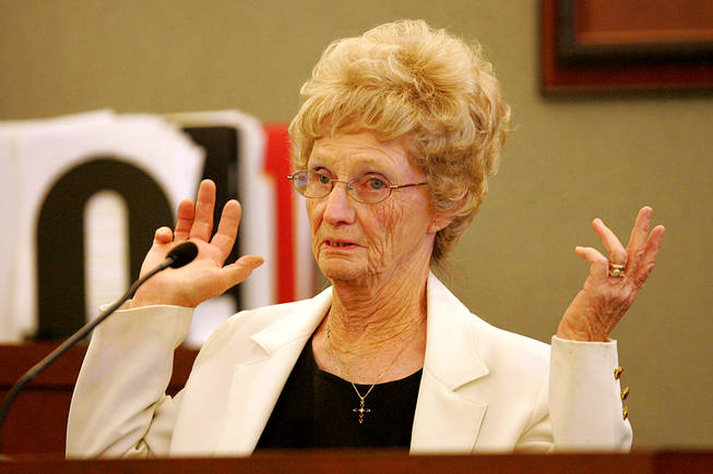 Eileen Nelson testifies during a coroner's inquest for Erik Scott at the Regional Justice Center Saturday, September 25, 2010. Nelson was describing how after Scott was shot, "he was stumbling back, with his hands up, empty," she said, with her elbows bent and her palms up, demonstrating what she saw.