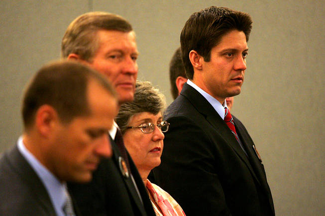 Members of Erik Scott's family, father Bill, mother Linda, and younger brother Kevin stand at the start of a coroner's inquest for Erik Scott at the Regional Justice Center Saturday, September 25, 2010.
