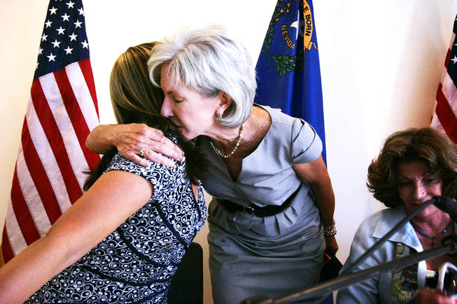Kelly Kosters, from left, gets a hug from U.S. Health and Human Services Secretary Kathleen Sebelius after Kosters talked about her sister's losing battle with leukemia and insurance companies during a meeting with the public led by Congresswomen Dina Titus and Shelley Berkley to talk about the recently-passed healthcare bill at the Henderson Multigenerational Center in Henderson Monday, September 27, 2010.