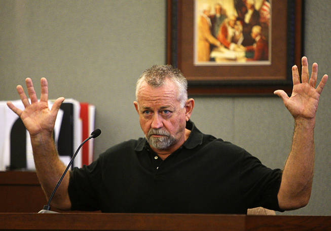 Costco shopper William Carlston testifies during a coroner's inquest for Erik Scott at the Regional Justice Center Monday, September 27, 2010. Scott was shot and killed by Metro Police Officers at the Summerlin Costco store on July 10. Carlston is describing the position of Scott's hands after he was shot and fell to the ground