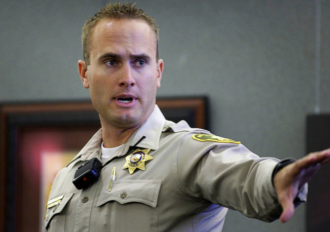 Metro Police Officer Joshua Stark gestures toward the jury as he testifies during a coroner's inquest for Erik Scott at the Regional Justice Center on Tuesday, Sept. 28, 2010. Stark was one of three officers who shot Scott. 