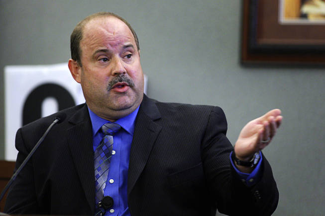 Metro Police Detective Barry Jensen testifies during a coroner's inquest for Erik Scott at the Regional Justice Center Tuesday, September 28, 2010. 